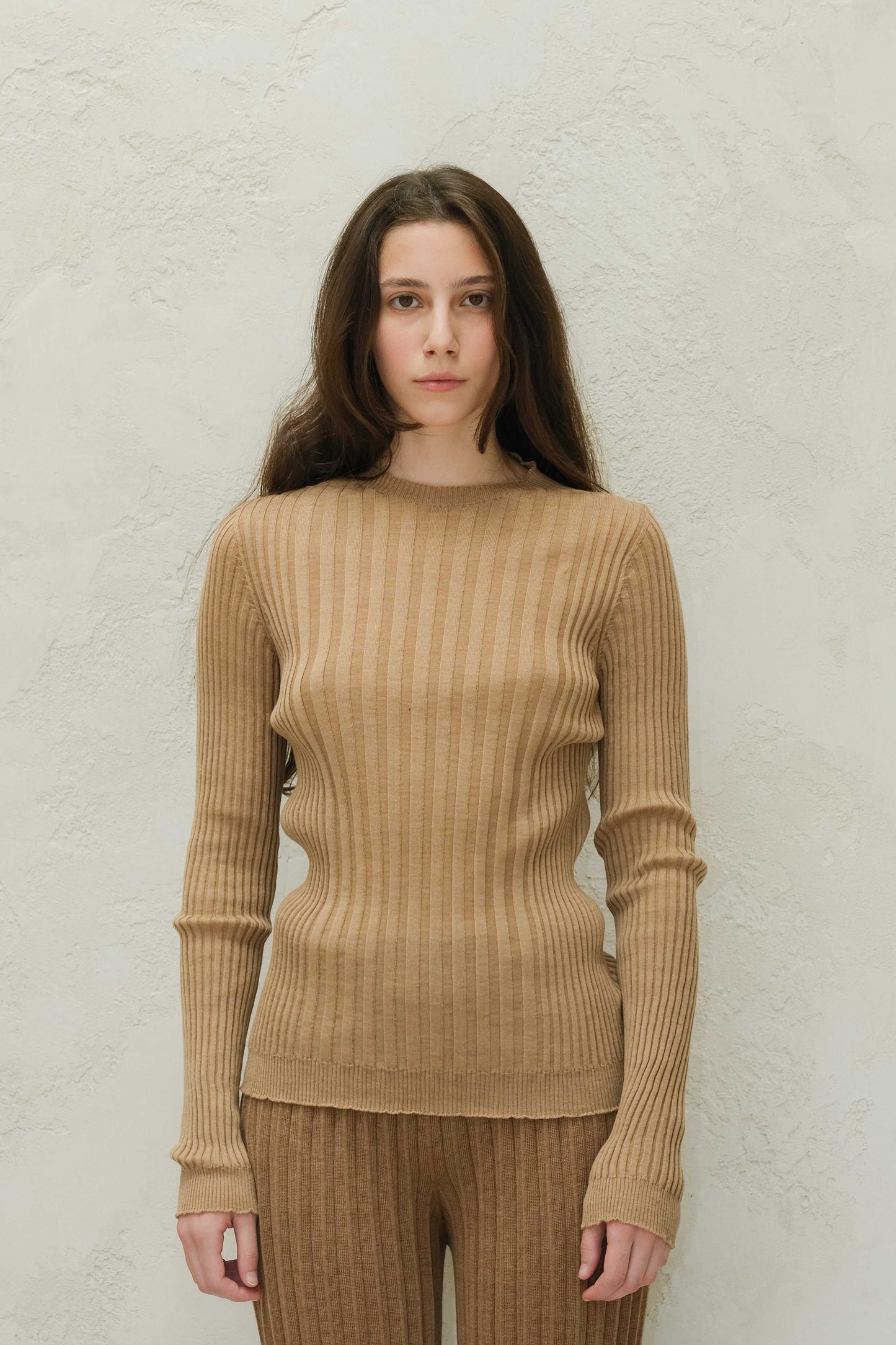 Close-up front view of camel Extra Fine Merino Wool Ribbed Crew Neck 3D-Knit Sweater, highlighting ribbed texture and slim-fit silhouette.