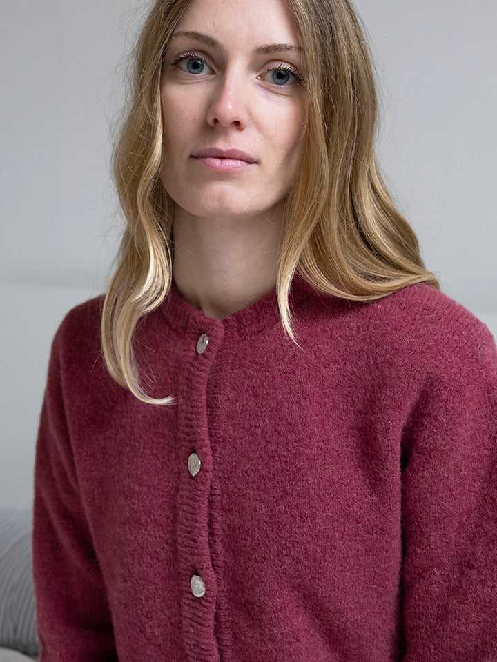 Detail of red Women's Fortuna Cardigan with Buttons, made from baby alpaca and merino wool, emphasizing eco-friendly Italian knitwear design.