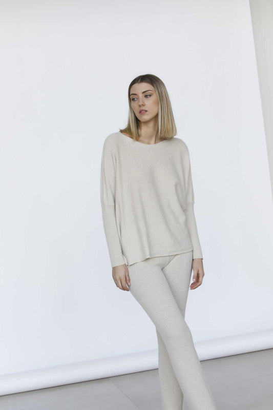 Full view of Margot Box-Fit Wool Sweater by Tenné paired with matching pants, showcasing side slits and soft drape for spring layering.