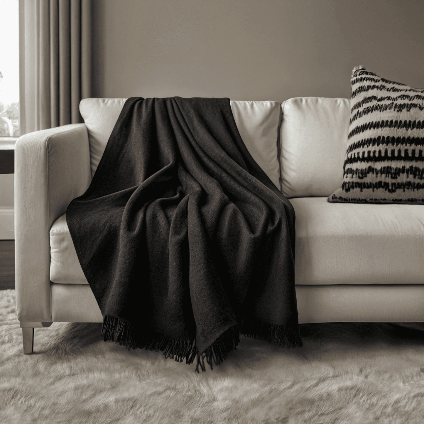 Cashmere Woven Throw - black cashmere woven throw on white sofa, luxurious and cozy blanket for modern home interiors.