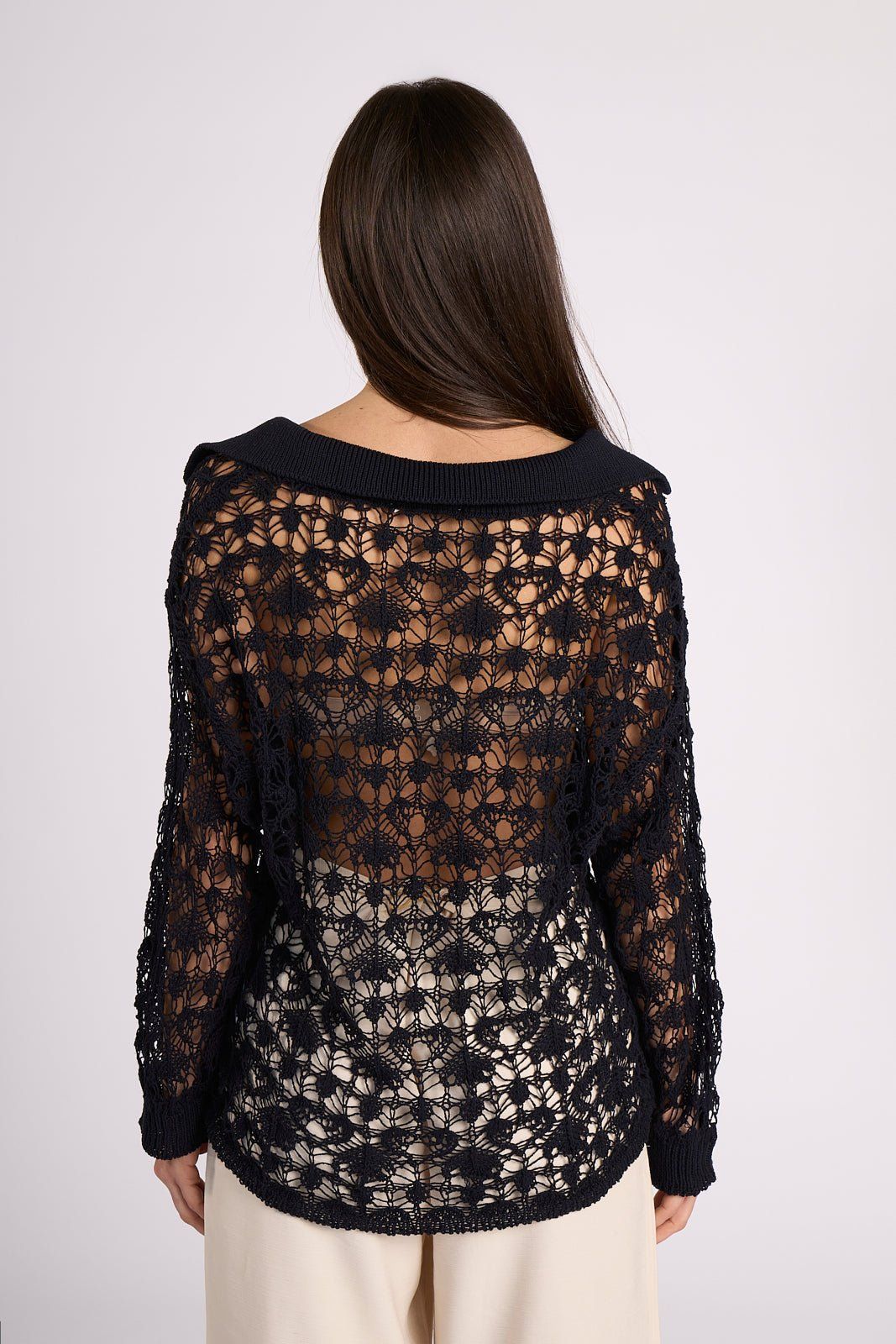 Back view of Ines Crochet Cotton Maxi Polo in black, displaying intricate open-knit cotton pattern and soft collar detail for a breezy summer look.