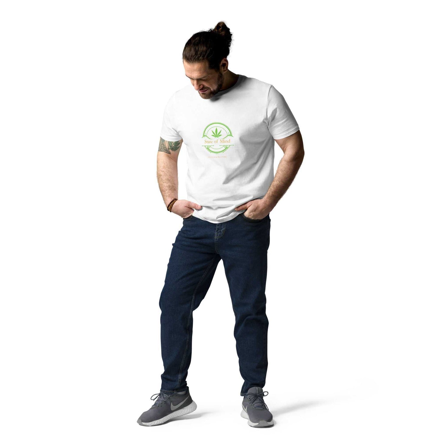 White State of Mind organic cotton unisex t-shirt styled with jeans. Clean green emblem design for a fresh and sustainable look.