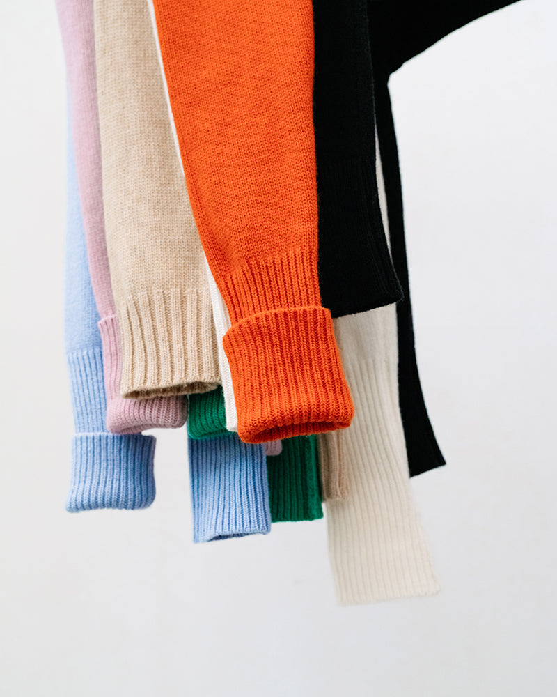 Different coloured sleeves from cashmere and merino knitwear sweaters.