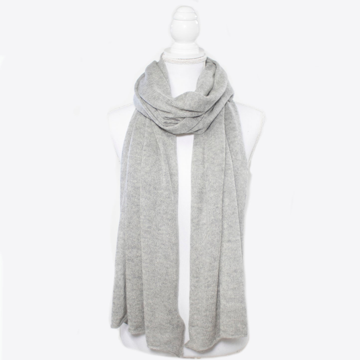 Lightweight cashmere wrap from Portolano in soft grey, ideal for elegant layering. 100% cashmere scarf in a timeless, breathable knit design.