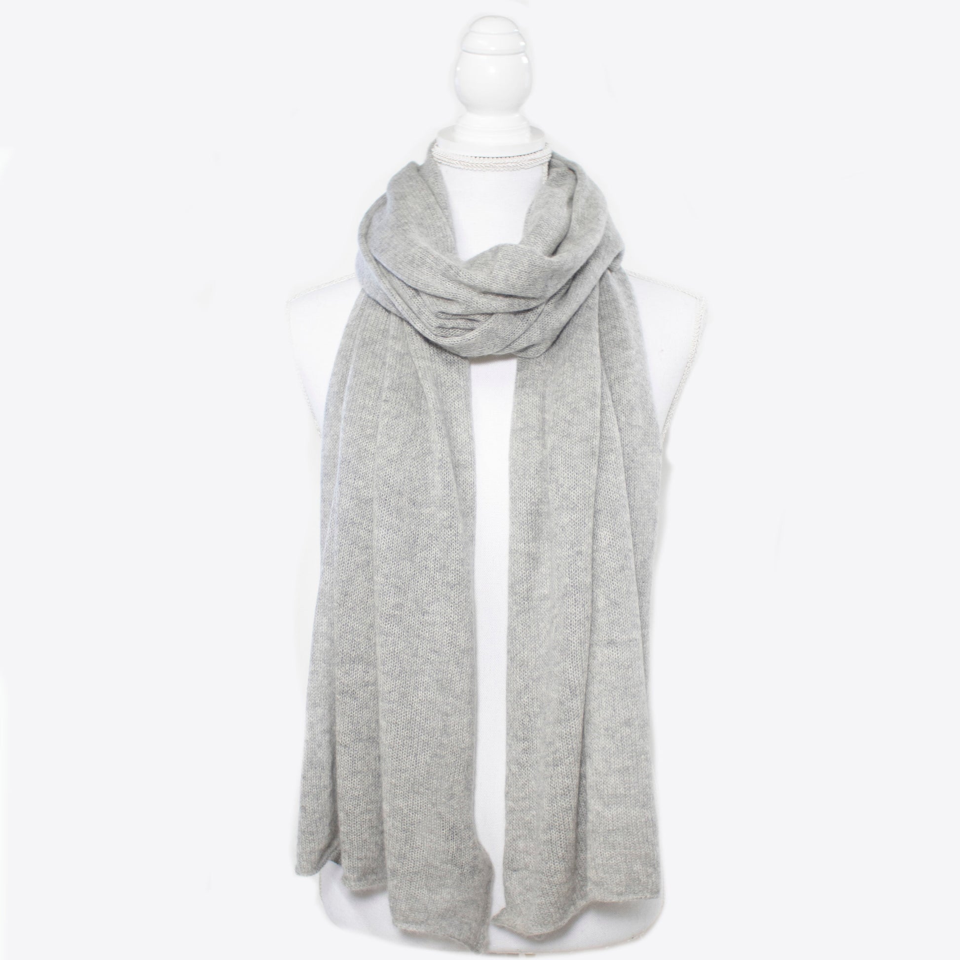 Lightweight cashmere wrap from Portolano in soft grey, ideal for elegant layering. 100% cashmere scarf in a timeless, breathable knit design.