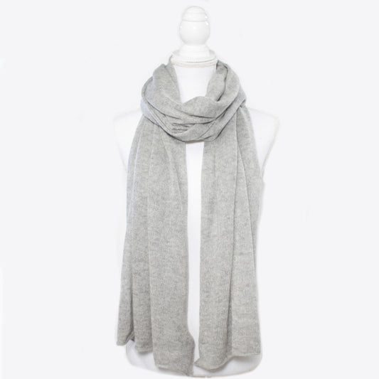 Lightweight cashmere wrap from Portolano in soft grey, ideal for elegant layering. 100% cashmere scarf in a timeless, breathable knit design.