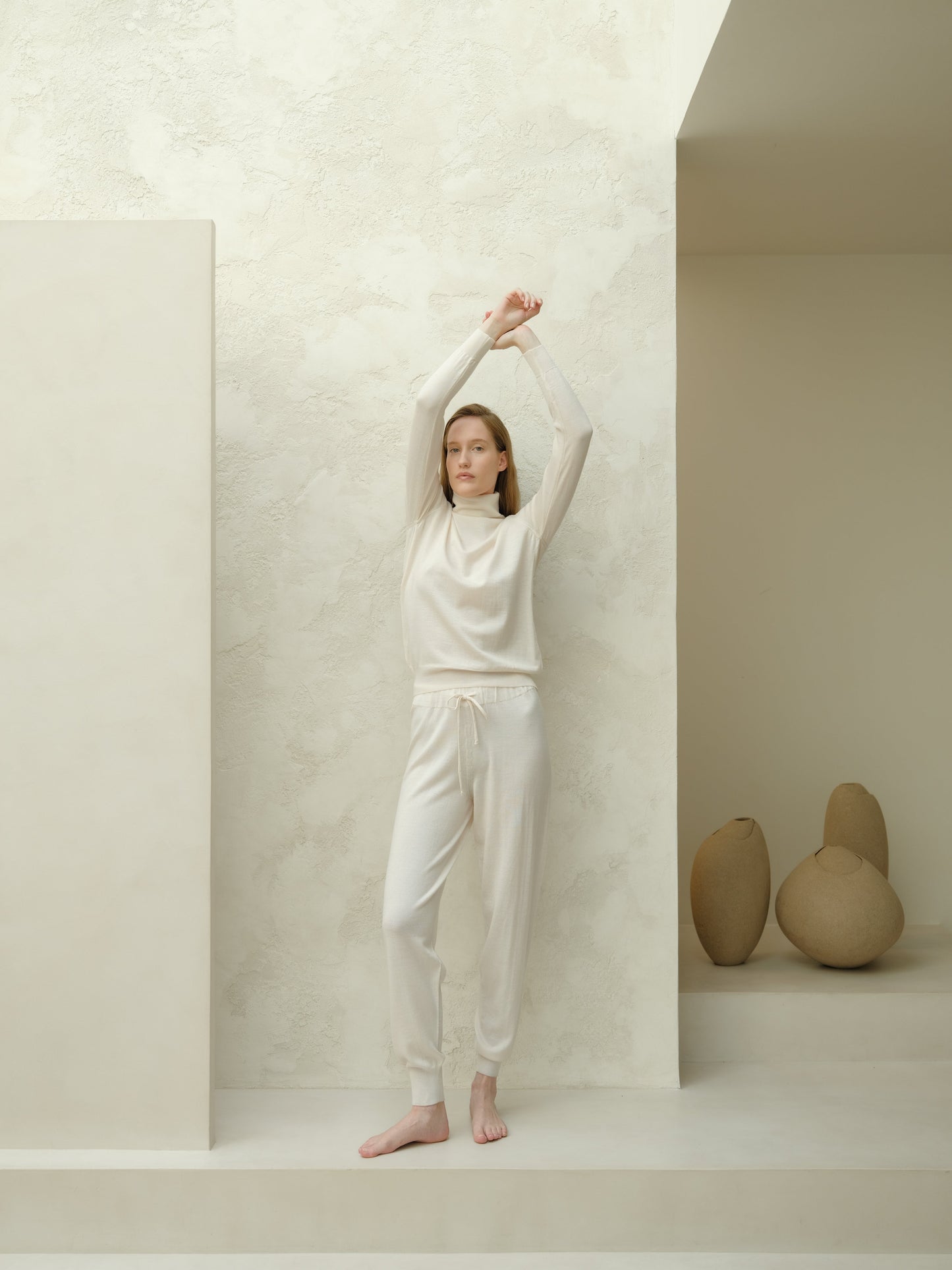 Extra Fine Merino Yoga Pants in ivory by Lèmme. Soft, thermoregulating Italian knitwear joggers for yoga and loungewear.