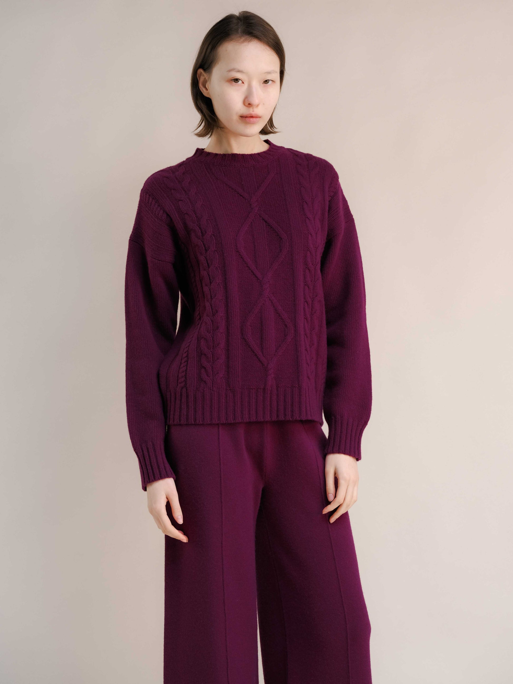 Plum Cashmere Mix Cable Knit Sweater styled with matching pants. Elegant sustainable knitwear from HenryPawHaven for cozy sophistication.