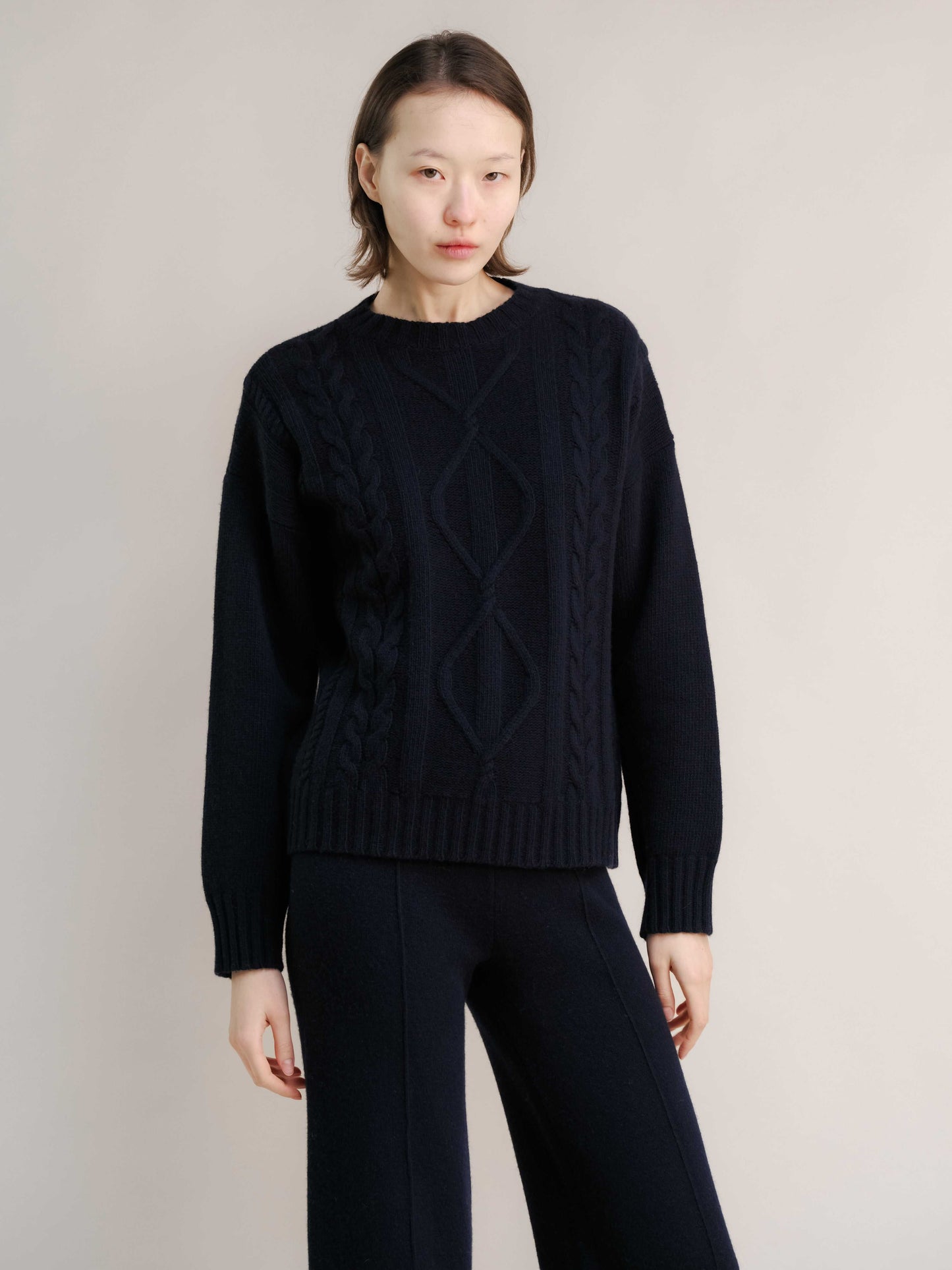 Black Cashmere Mix Cable Knit Sweater with matching trousers. Minimalist sustainable knitwear from HenryPawHaven for timeless style.