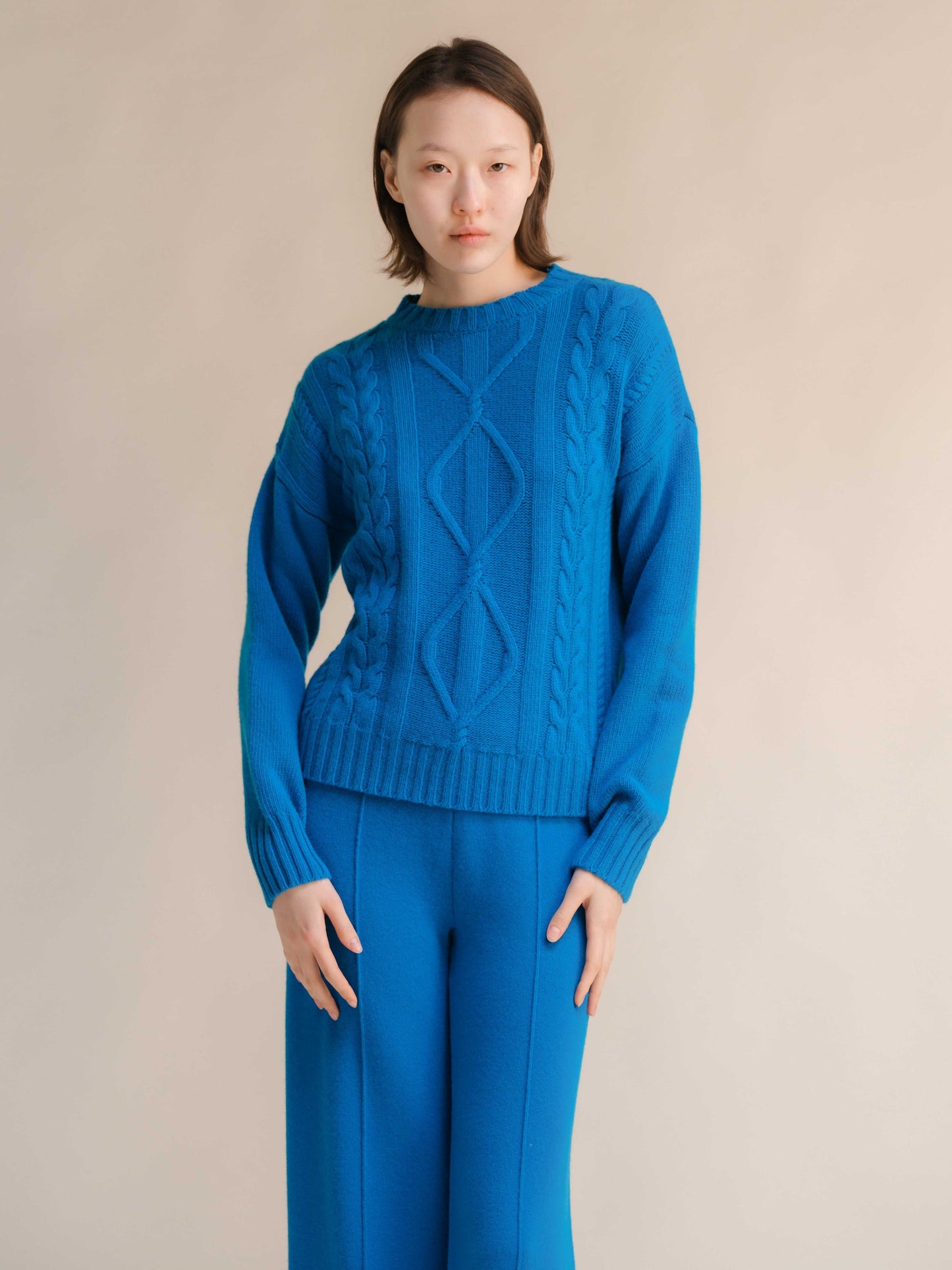 Bright blue Cashmere Mix Cable Knit Sweater with ribbed neckline and Italian craftsmanship, part of sustainable knitwear collection by HenryPawHaven.