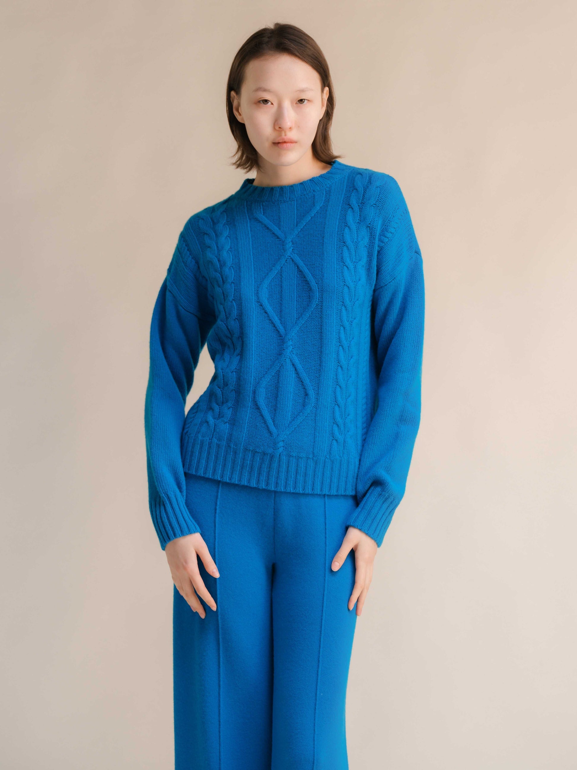 Bright blue Cashmere Mix Cable Knit Sweater with ribbed neckline and Italian craftsmanship, part of sustainable knitwear collection by HenryPawHaven.