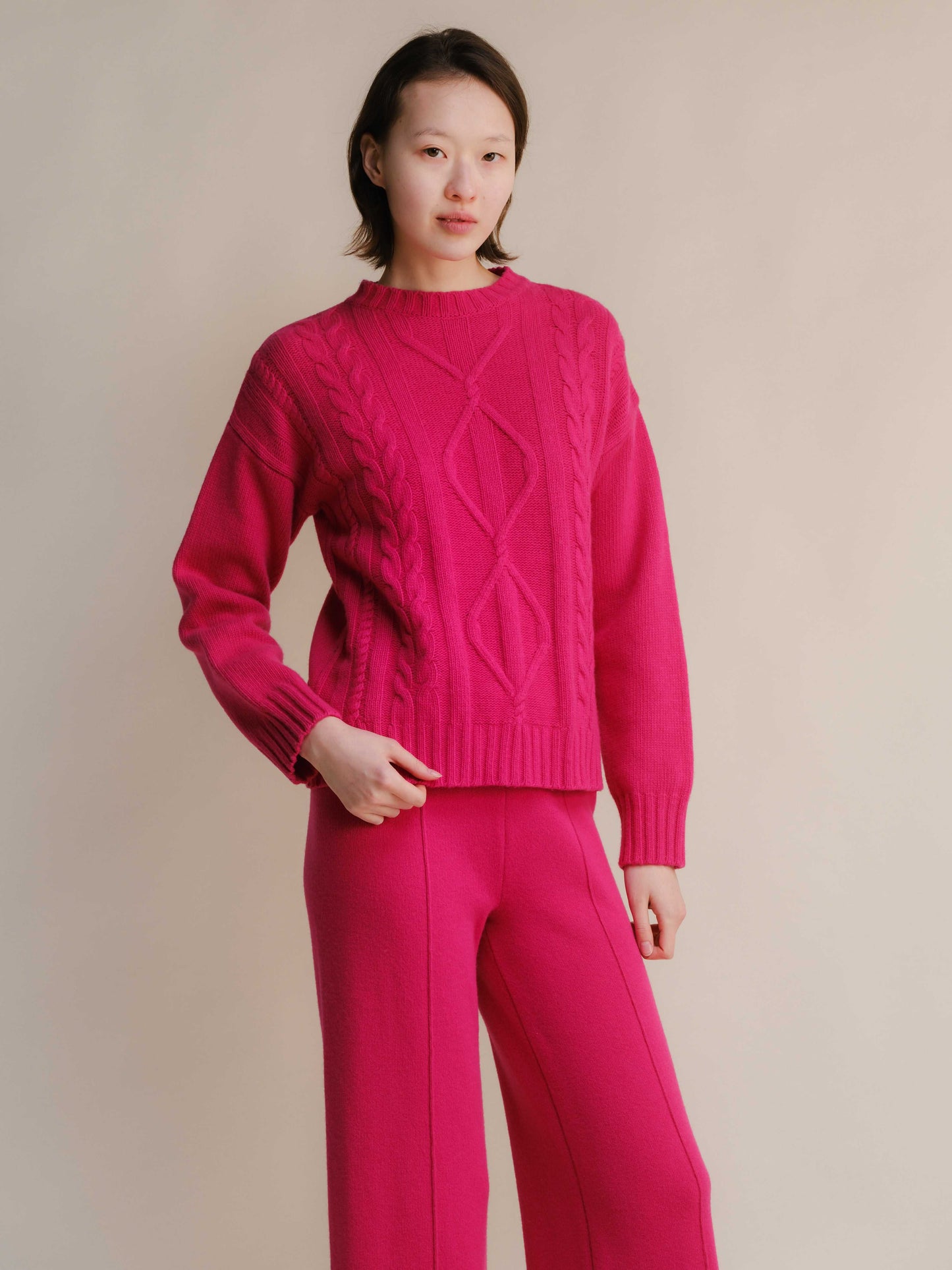 Fuchsia Cashmere Mix Cable Knit Sweater with matching pants. Bold sustainable knitwear from HenryPawHaven for vibrant comfort.