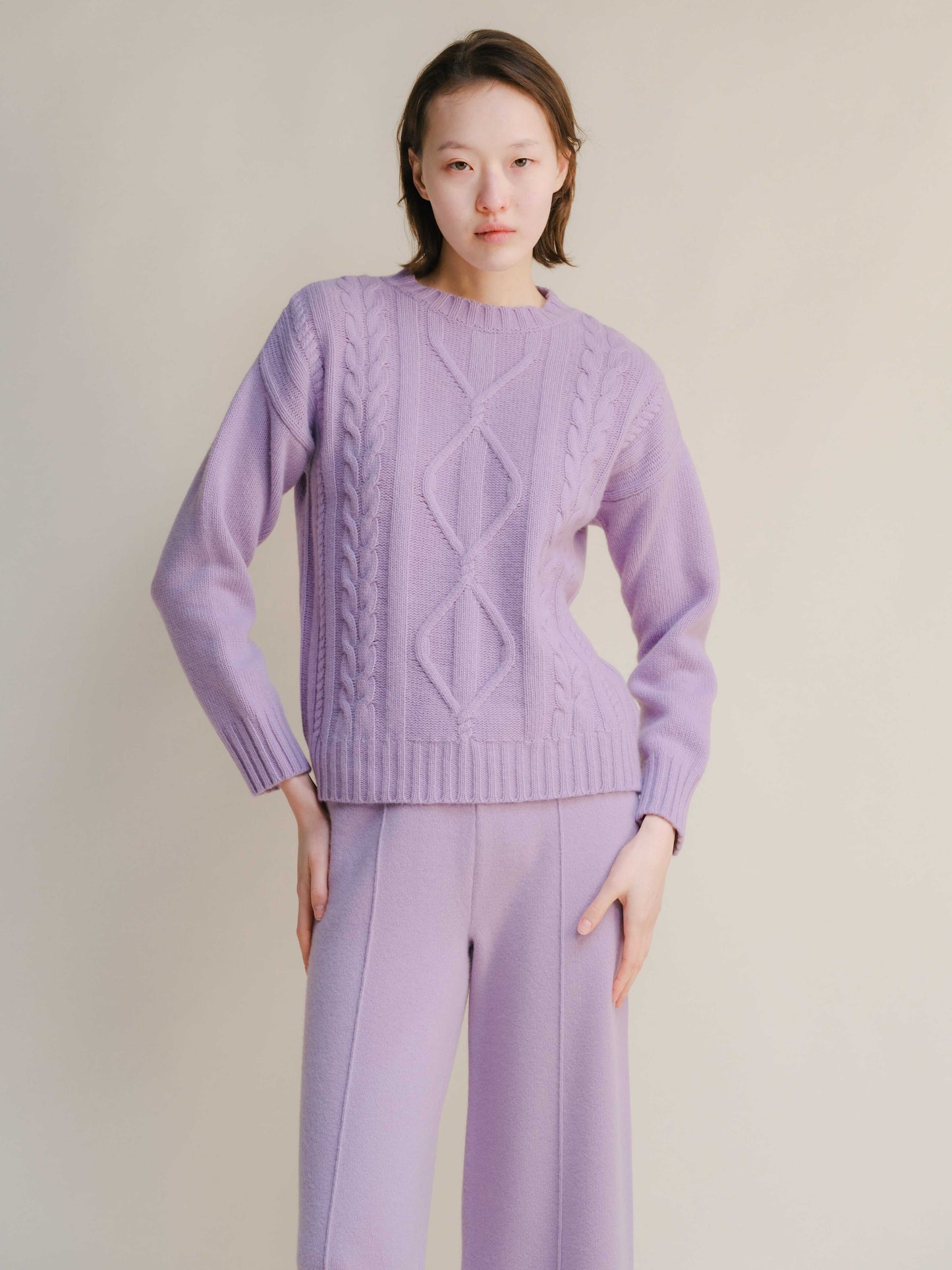 Lavender Cashmere Mix Cable Knit Sweater featuring intricate cable patterns and soft texture, ideal for elegant comfort in eco-conscious apparel.
