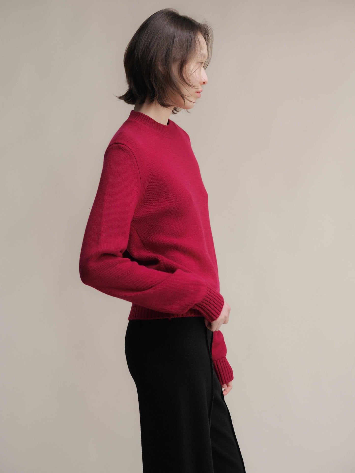 Side profile of red Pure Cashmere Crewneck Sweater with relaxed fit. Soft, premium knitwear by Lèmme for HenryPawHaven.