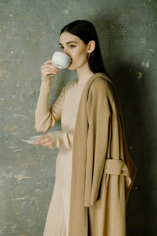 Beige Extra Fine Merino Wool Ribbed Crew Neck 3D-Knit Sweater styled with matching knit pants and coat, breathable and OEKO-TEX certified.