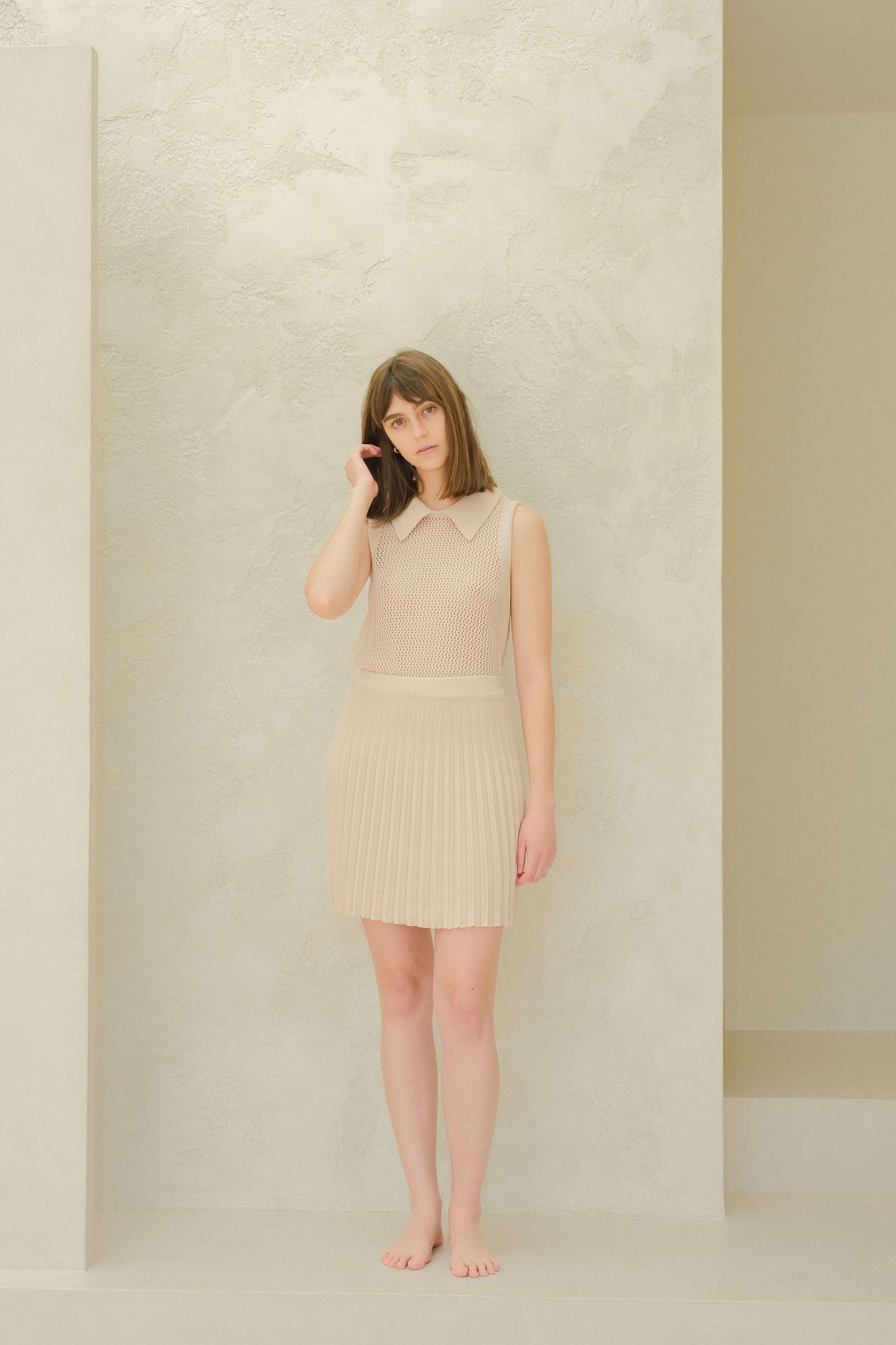 Fine Cotton Plissé Mini Skirt in beige with sleeveless top