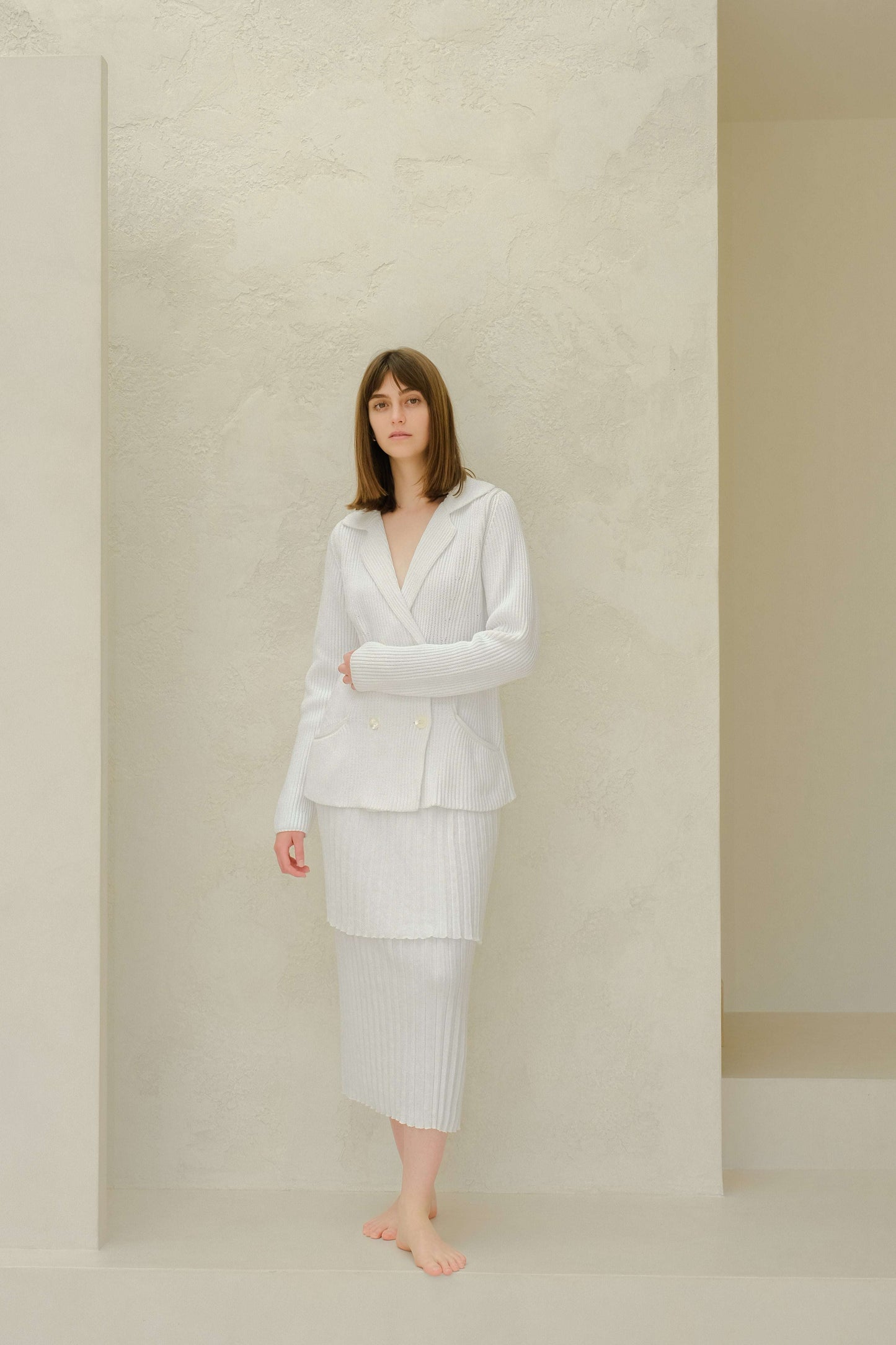 White fine cotton double breasted knit jacket paired with ribbed midi skirt, showcasing elegant Italian design from HenryPawHaven.