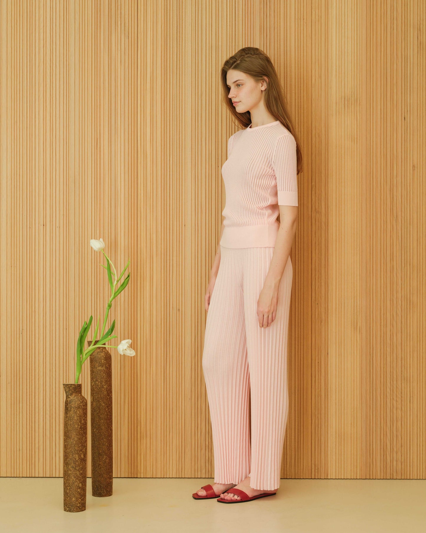 Side view of light pink fine cotton T-shirt with micro pointelle and matching pants. Soft Italian knitwear for summer, regular fit.