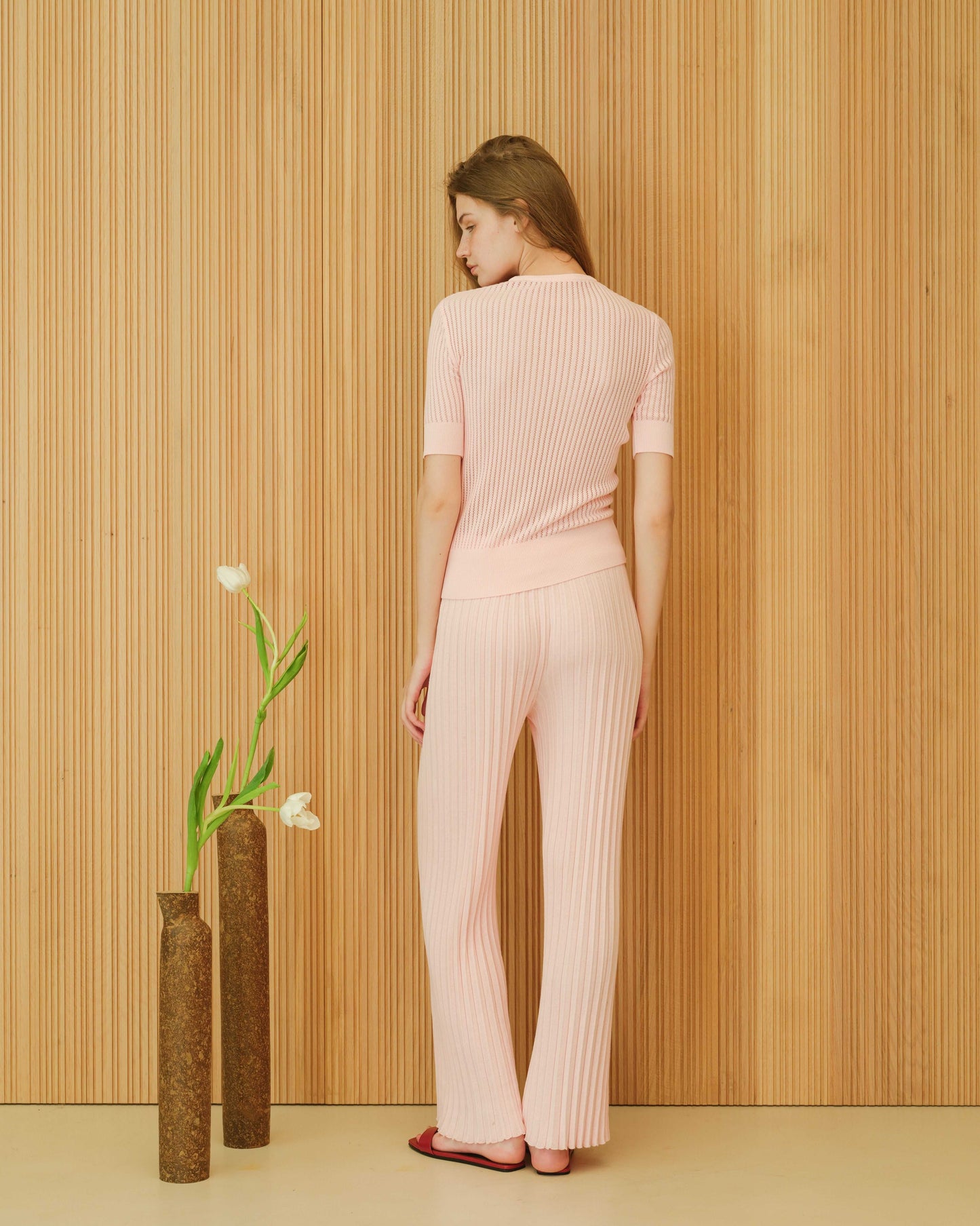 Back view of light pink micro pointelle cotton T-shirt and pants set. Italian summer knitwear made from OEKO-TEX® certified cotton.