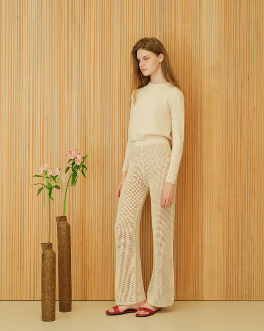 Crochet Cotton Pants in cream by HenryPawHaven, lightweight Italian openwork knitwear with regular fit, styled with matching sweater.
