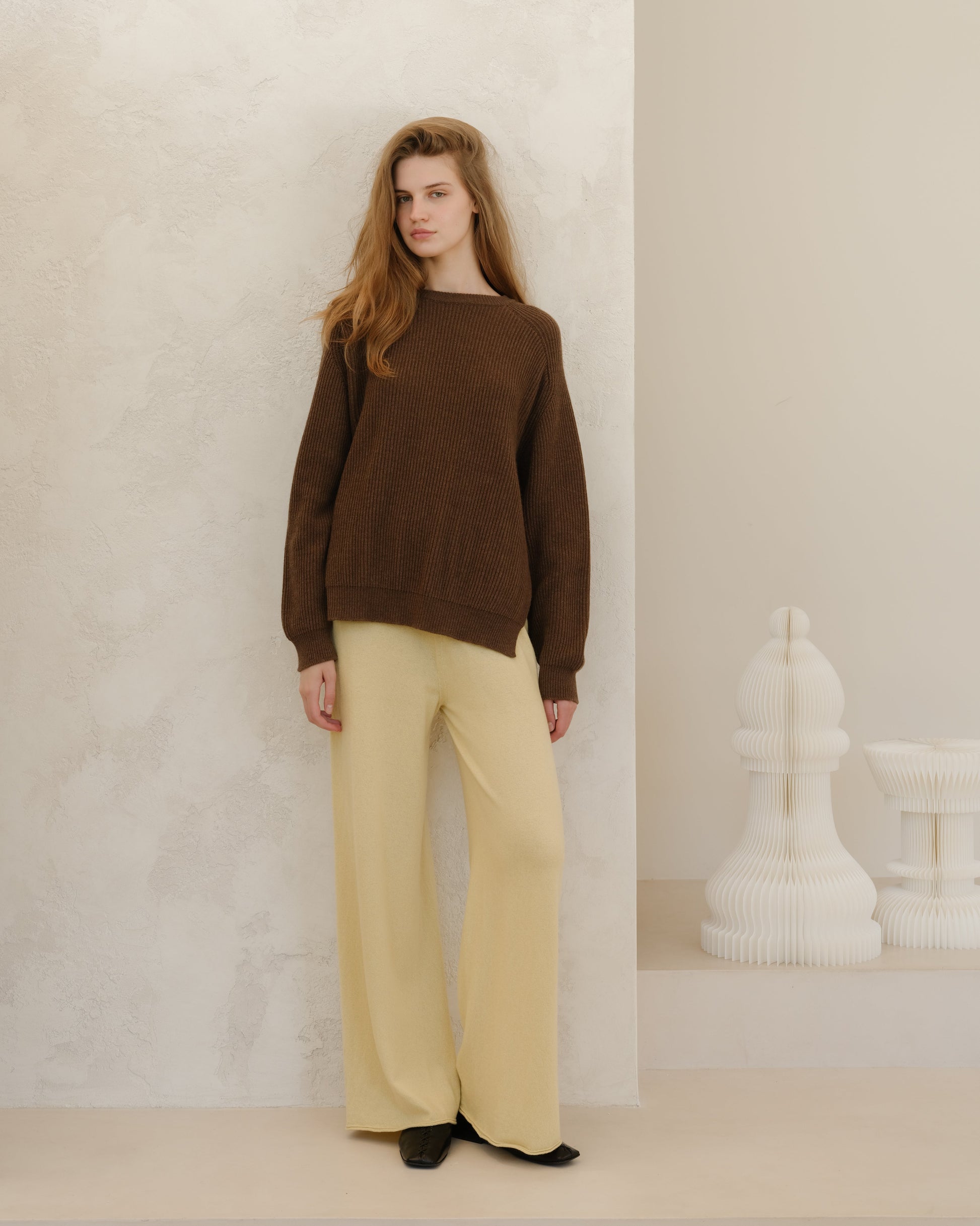 Yellow 3D Cashmere Mix Wide Legged Light Pants by Lèmme paired with brown knit top, showcasing Italian craftsmanship in sustainable fashion.