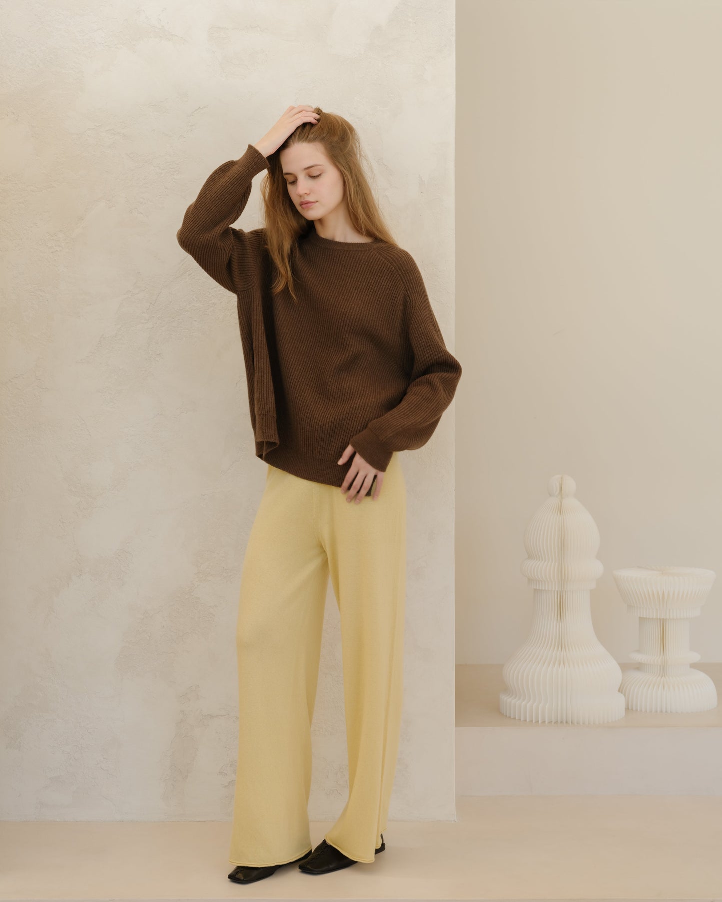 Yellow 3D Cashmere Mix Wide Legged Light Pants by Lèmme paired with brown knit top, Italian luxury loungewear in sustainable cashmere blend.