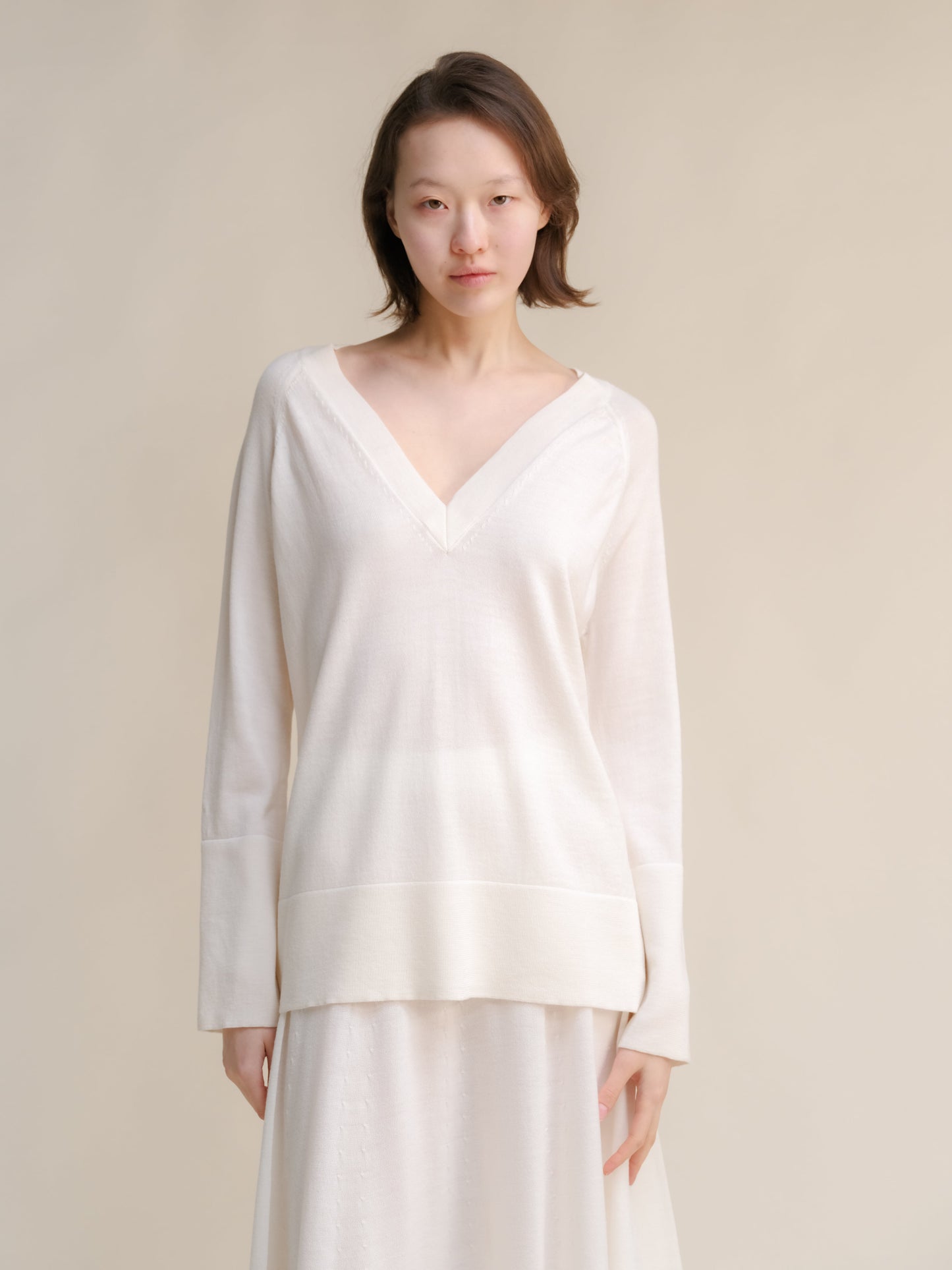 Pull long en mérinos extrafin à col en V