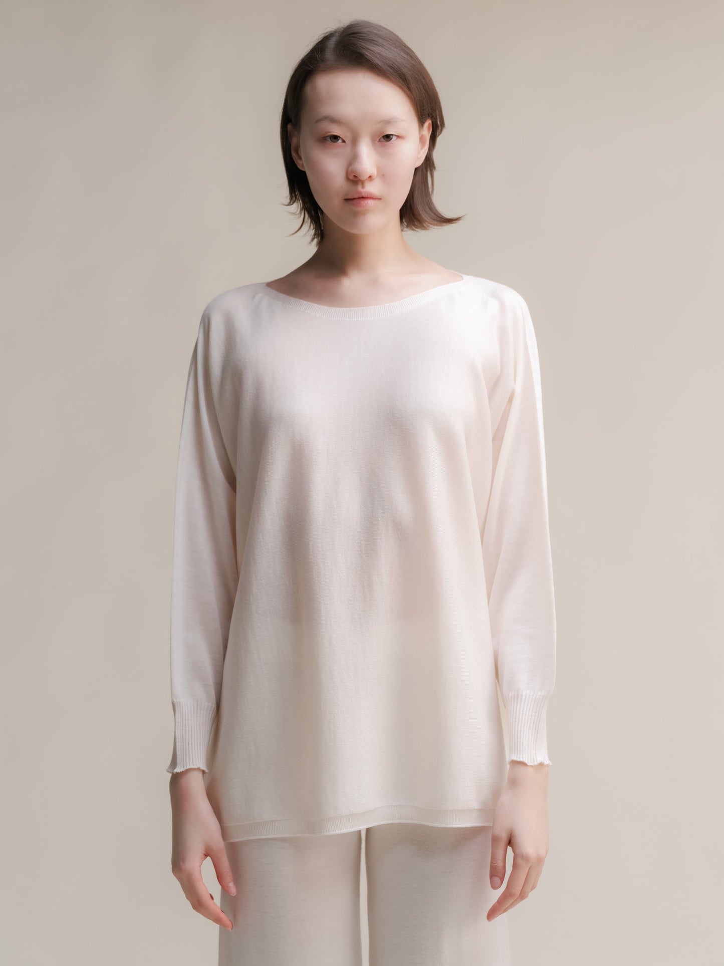 Ivory Extra Fine Merino Wool Boat Neck Oversized Sweater, lightweight Italian knitwear with seamless construction and ribbed edges.