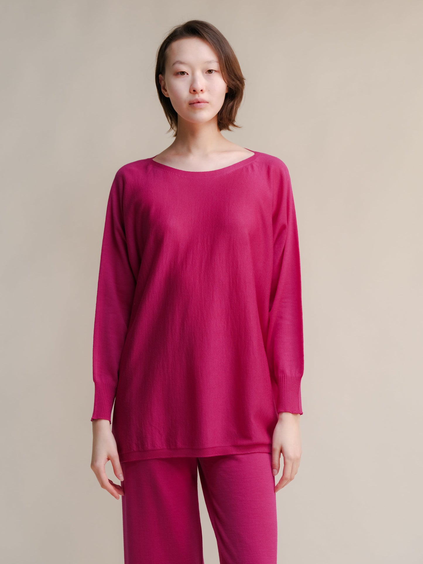Fuchsia Extra Fine Merino Wool Boat Neck Oversized Sweater, breathable Italian 3D-knit with long sleeves and minimalist silhouette.