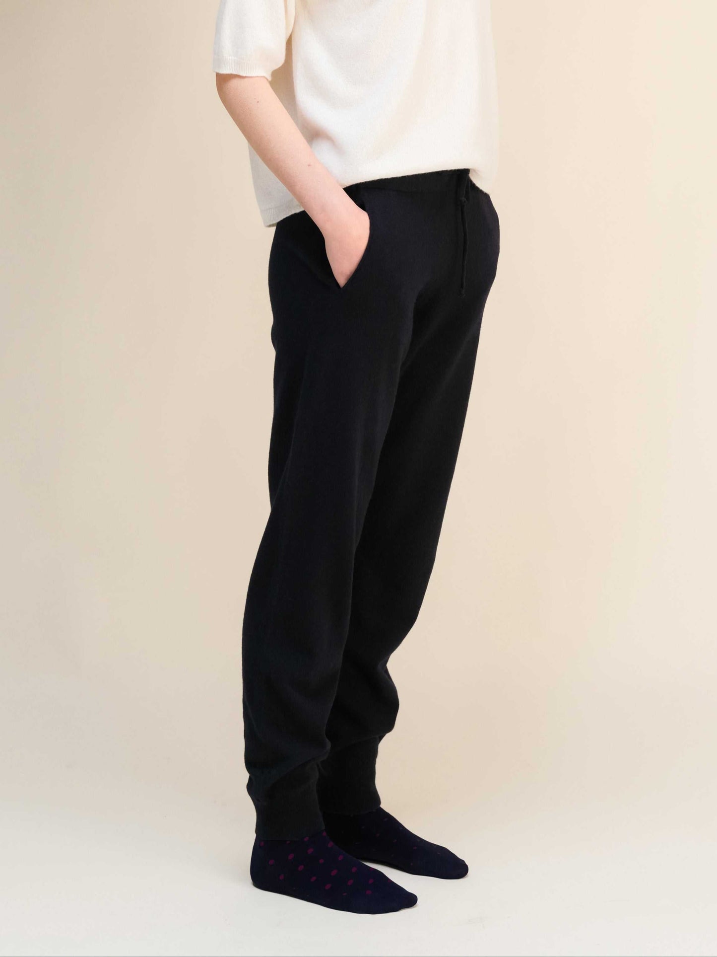 Black Cashmere Yoga Pants 3D-Knit with ribbed cuffs and drawstring waist, shown in side view for detail on fit and texture.