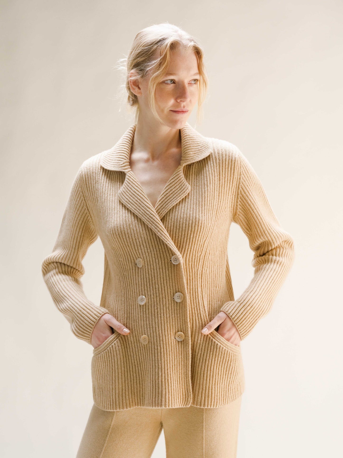 Beige cashmere wool blend double breasted jacket with tailored fit and functional pockets, part of luxury Italian knitwear collection.