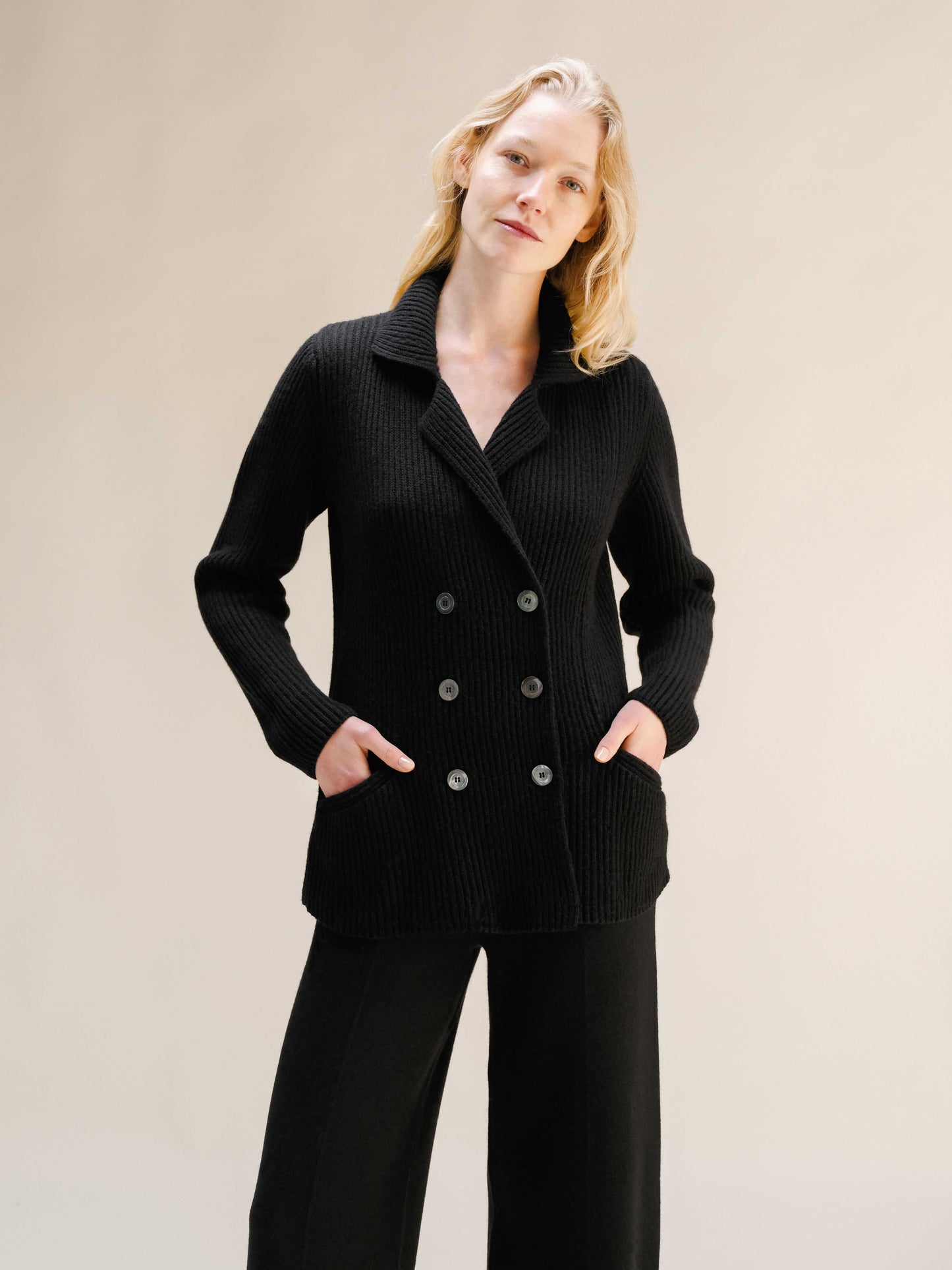 Cashmere wool blend double breasted jacket in black with tailored design and functional pockets, part of Italian luxury knitwear collection.