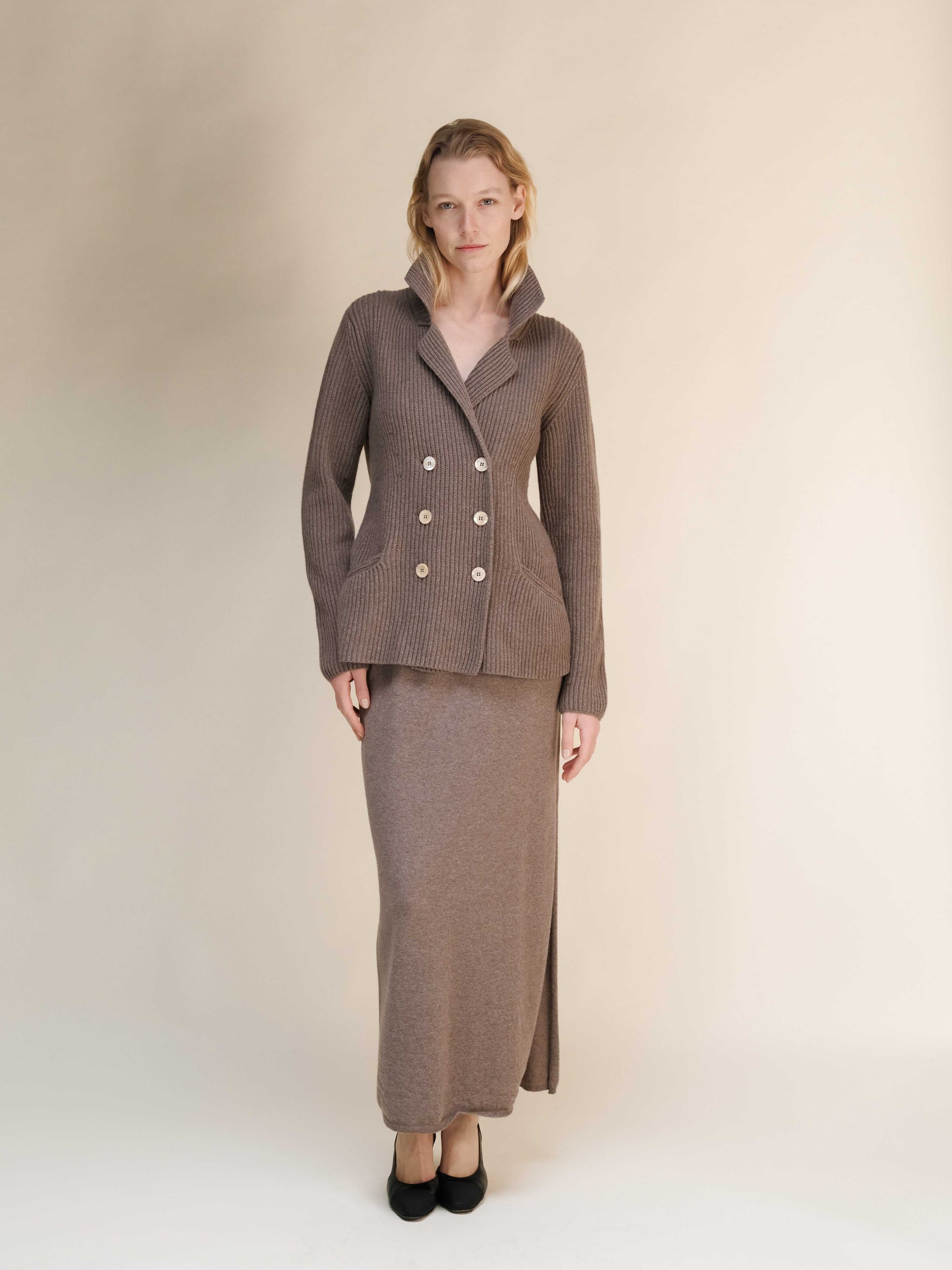 Front view of taupe Italian knitwear jacket in cashmere wool blend, double breasted with relaxed fit and refined silhouette.