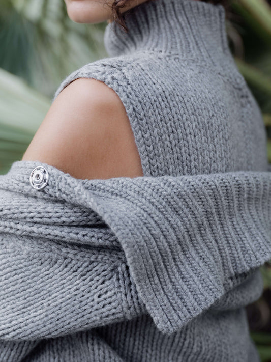 Close-up of grey cashmere mix chunky cardigan showing shoulder button detail and thick ribbed knit. Premium Italian cardigan from HenryPawHaven.