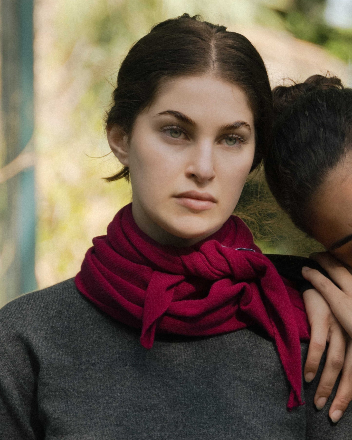 Cashmere Mix Triangle Scarf in deep red styled around the neck. Lightweight Italian knitwear ideal for versatile seasonal layering.