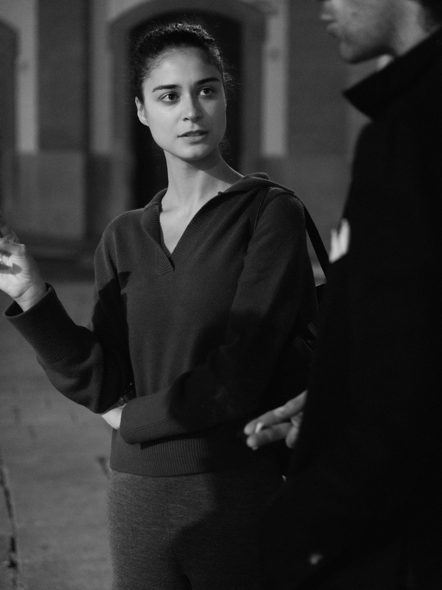 Woman wearing dark Cashmere-Wool Blend Relaxed Polo by HenryPawHaven, styled casually outdoors. Highlights relaxed fit and Italian elegance.