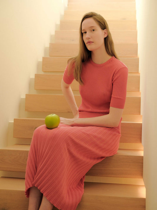 Italian summer knitwear T-shirt in coral pink with micro pointelle, paired with matching ribbed skirt. Made in Italy, 100% fine cotton.