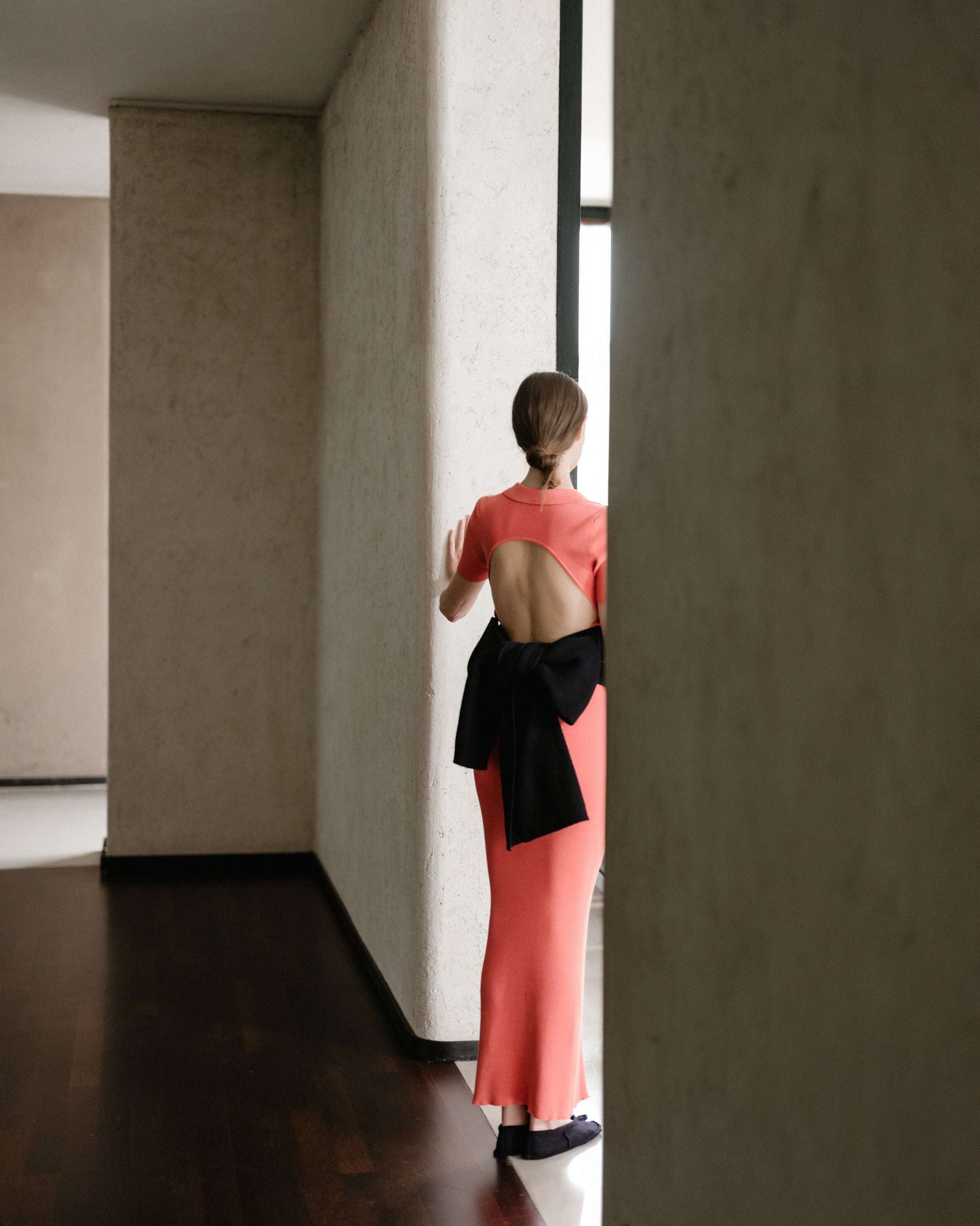 Coral open-back dress with bow