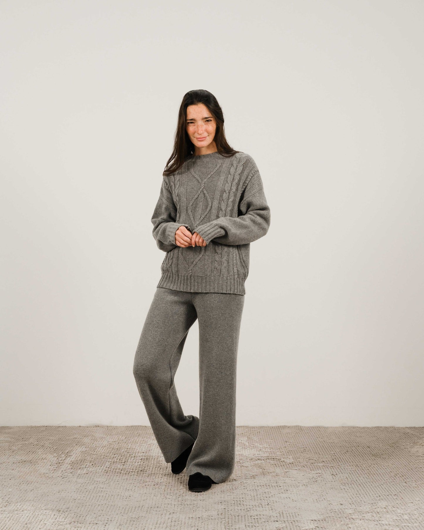 Gray Cashmere Mix Cable Knit Sweater styled with matching pants. Cozy and sustainable knitwear from HenryPawHaven for everyday elegance.