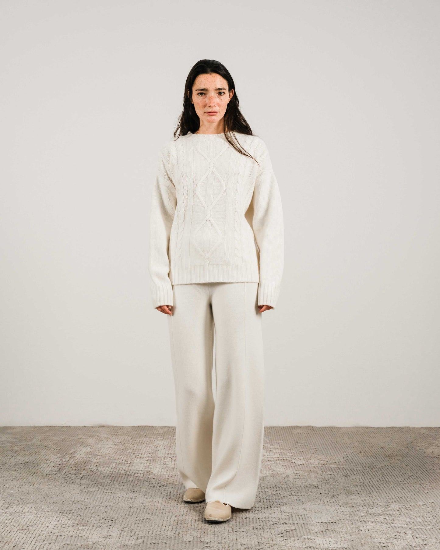 White Cashmere Mix Cable Knit Sweater paired with matching pants. Sustainable knitwear from HenryPawHaven for clean, elegant comfort.