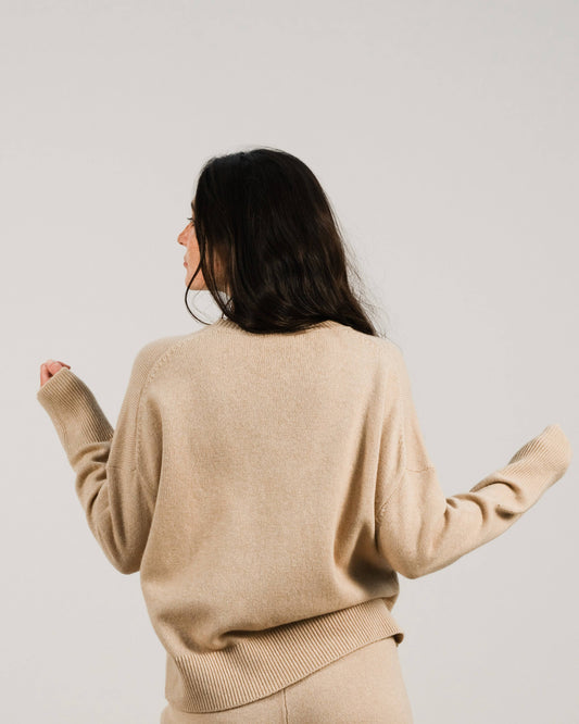 Oversized Cashmere Mix Relaxed Crewneck Sweater in beige, shown from the back to highlight its relaxed fit and soft knit texture.