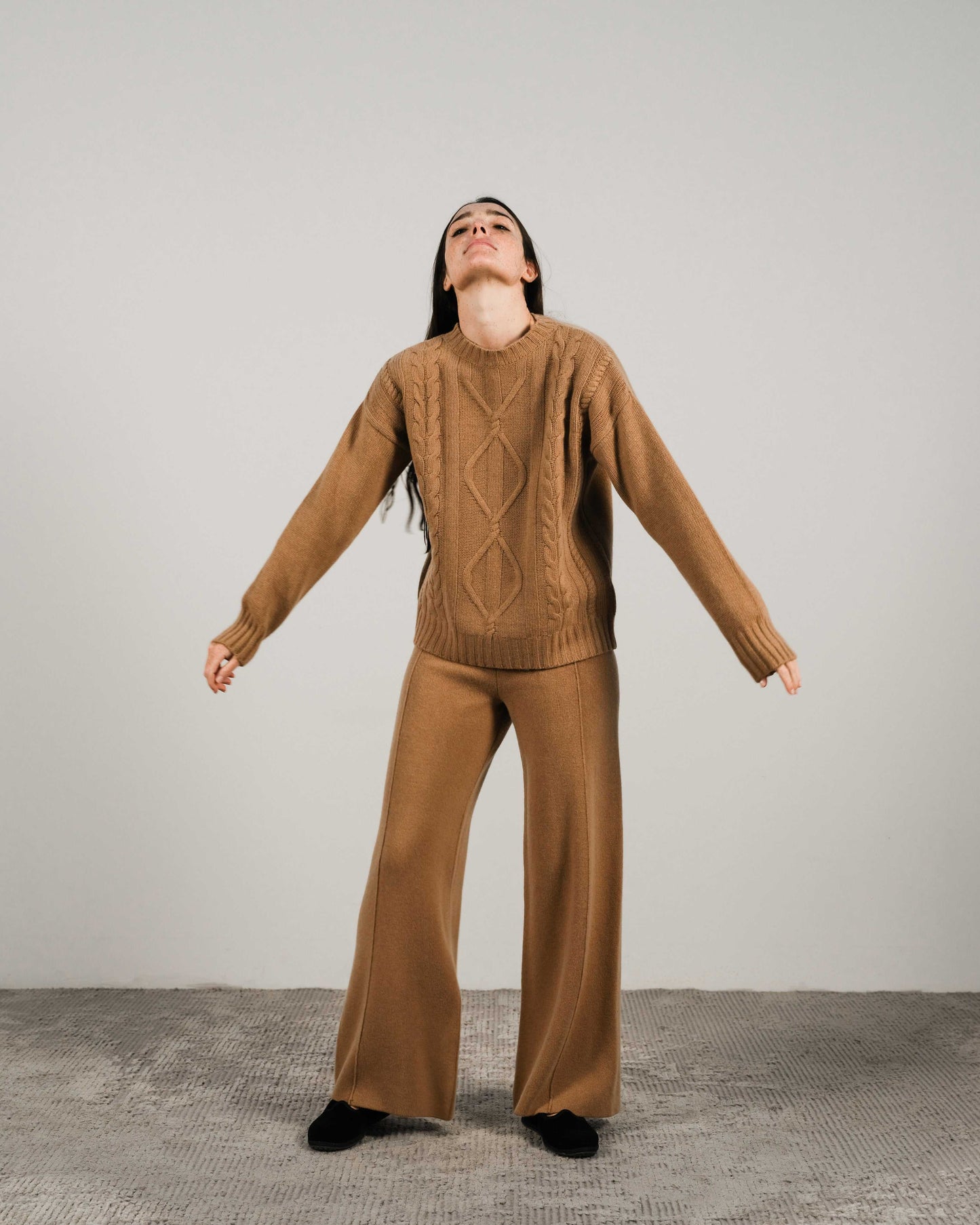 Camel-toned Cashmere Mix Cable Knit Sweater with classic cable design and ribbed hem, offering timeless style in sustainable knitwear.