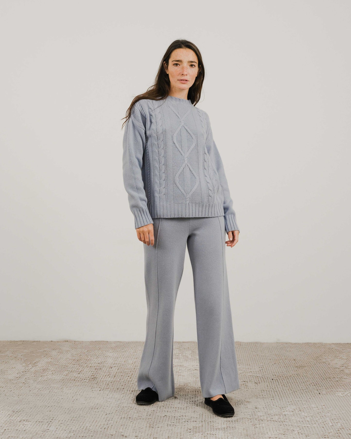 Light blue Cashmere Mix Cable Knit Sweater paired with coordinated pants, crafted in Italy for premium comfort and eco-friendly fashion.