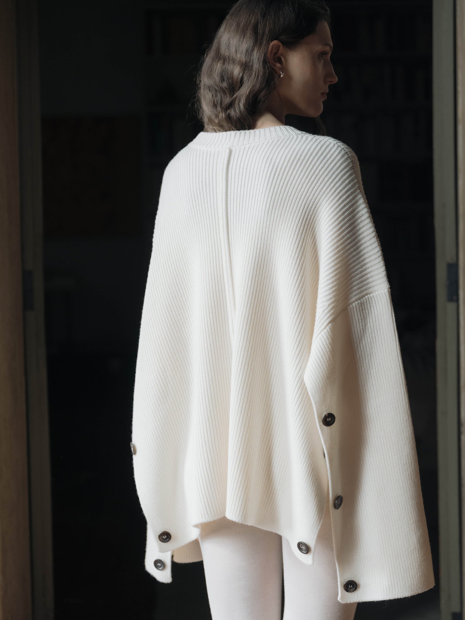 Rear angle of Extra Fine Merino Convertible Cape Sweater by Lèmme, highlighting premium Italian knitwear craftsmanship and draped silhouette.