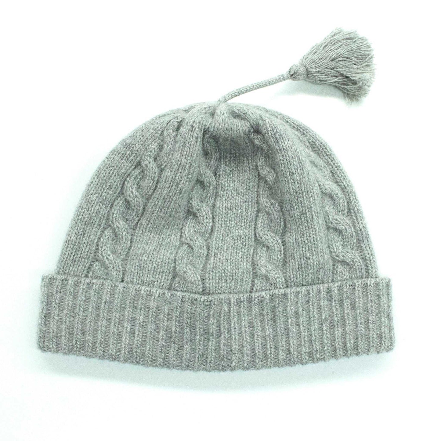 Portolano Baby Cashmere Hat in grey featuring a cozy cable knit pattern and tassel. Premium baby hat made from 100% soft cashmere.