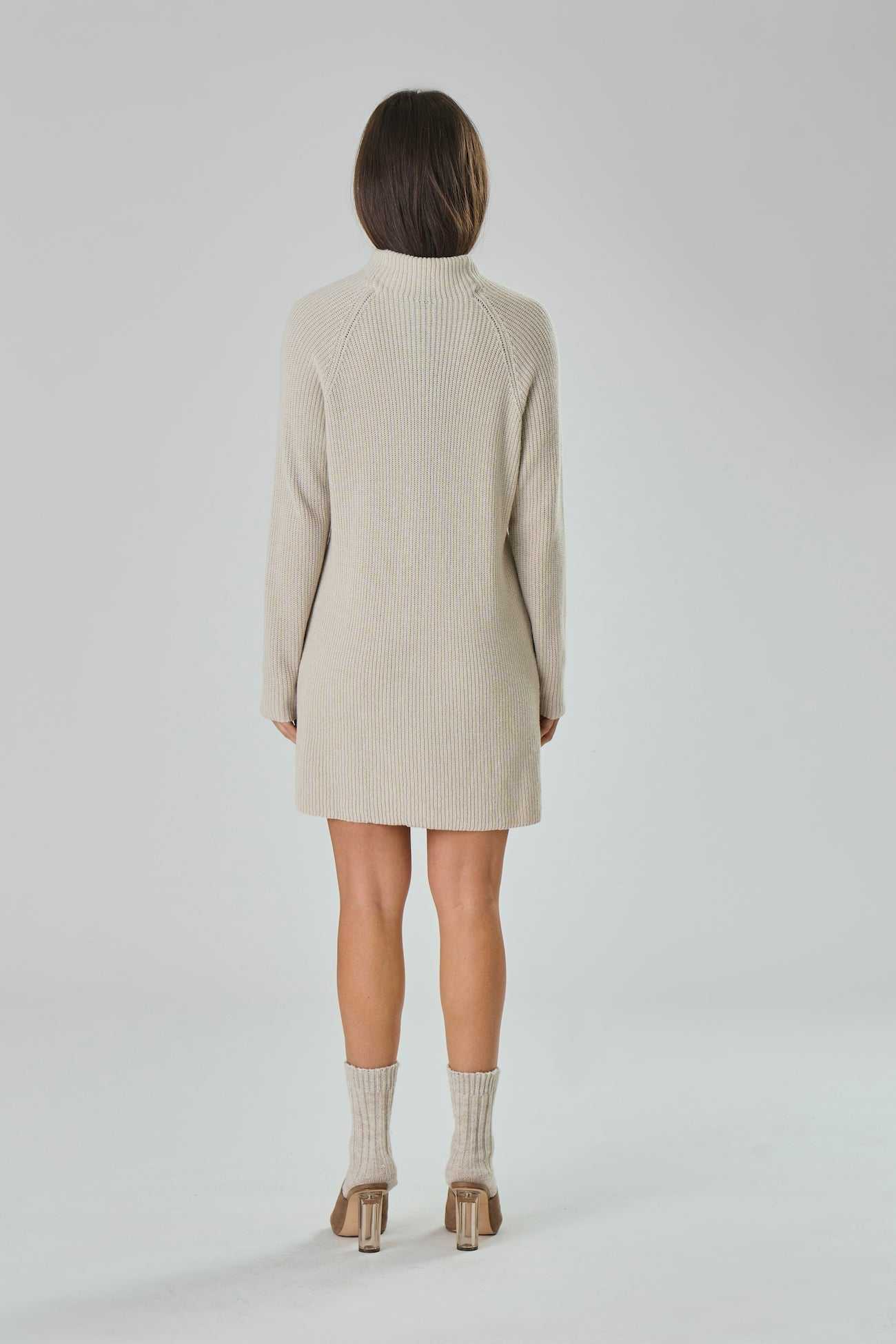 Back view of beige Cashmere Blend Knit Dress - Agnese by Tenné with ribbed texture and long sleeves. A timeless choice for sustainable winter fashion.