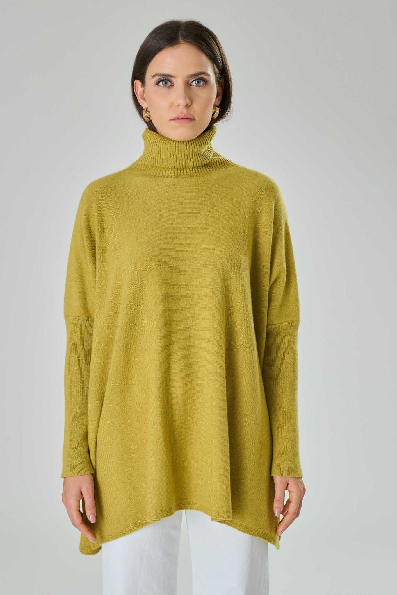 Front view of Amalia Cashmere Blend Turtleneck Sweater in Blue by Tenné, highlighting oversized fit, ribbed collar, and soft cashmere blend fabric.