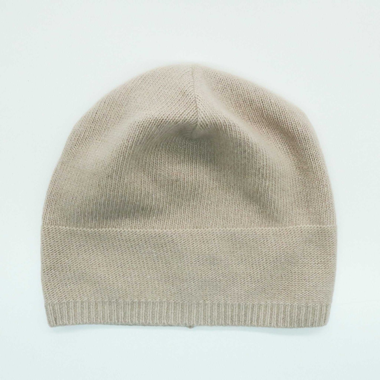 Beige Portolano Women's Cashmere Slouchy Hat displayed flat. 100% cashmere with ribbed hem and relaxed crown for stylish comfort.