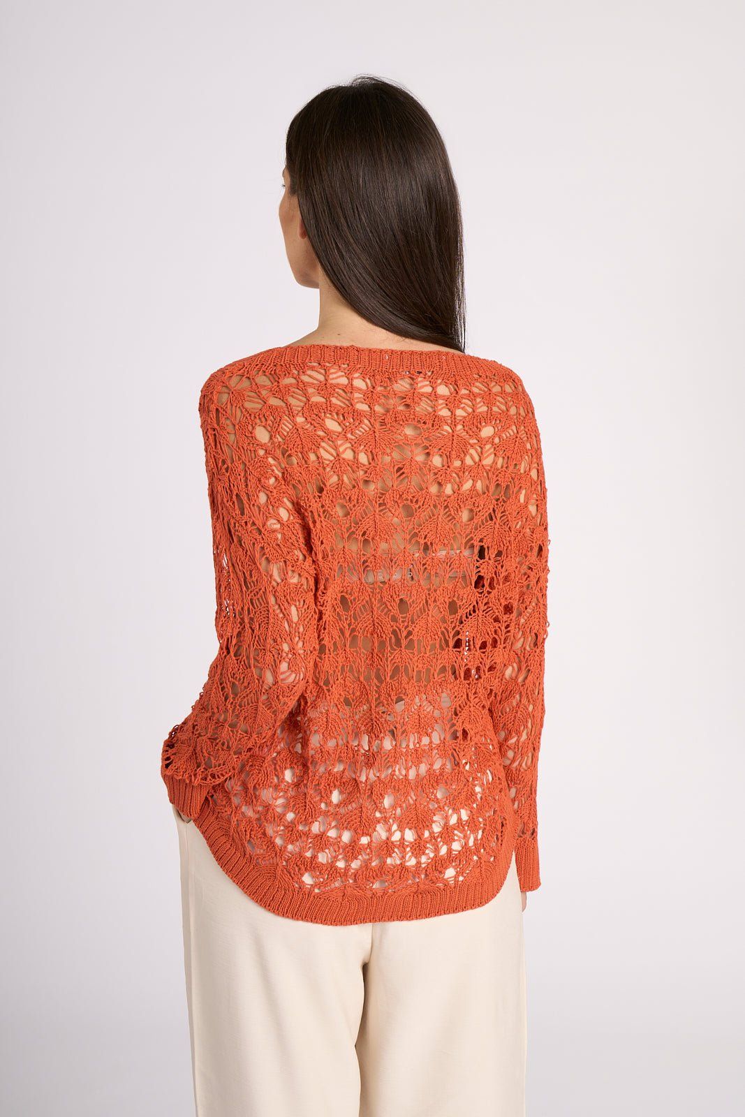 Rear view of burnt orange Elisa Crochet Cotton Top by Tenné, highlighting detailed crochet work and breathable 100% cotton fabric.