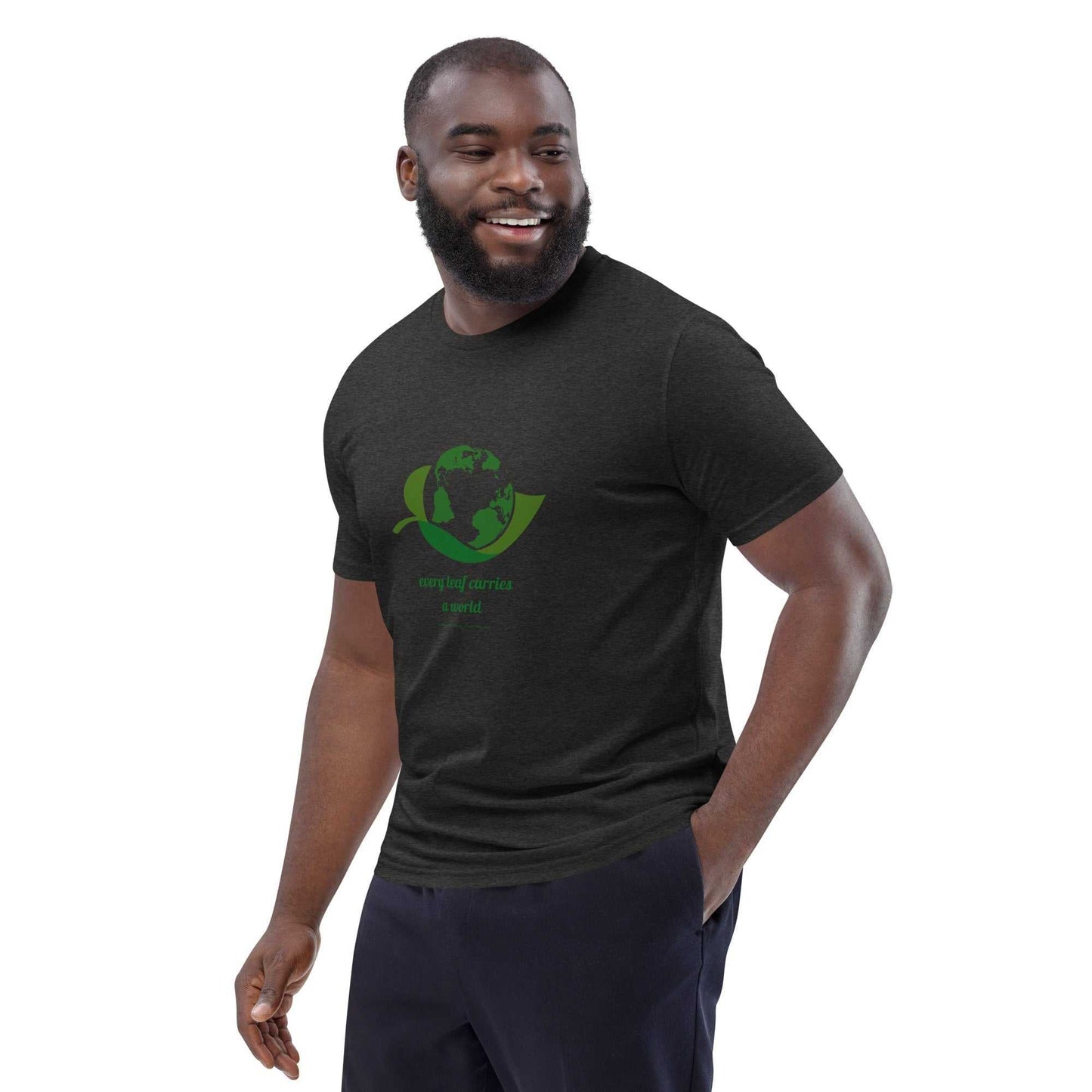 Smiling model in dark heather Organic Cotton Nature T-Shirt with green environmental print, showcasing sustainable unisex style.